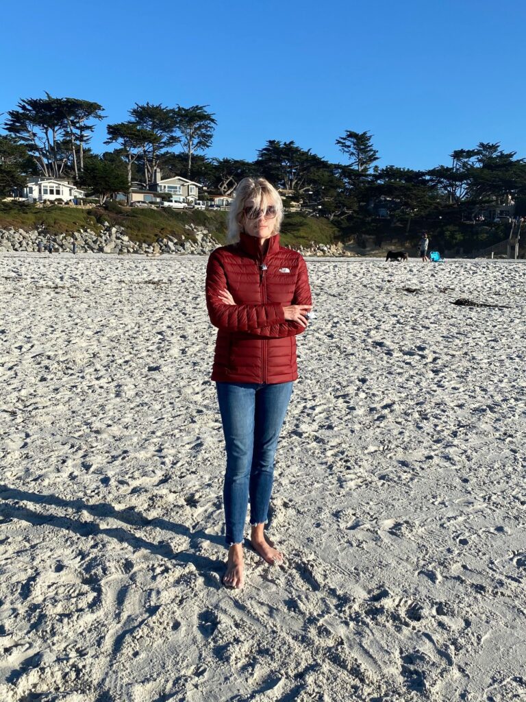 Woman standing on beach in Carmel